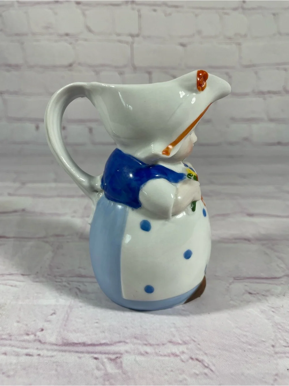 Vintage Dutch Girl Holding Flowers Hand Painted Ceramic Creamer Pitcher Germany